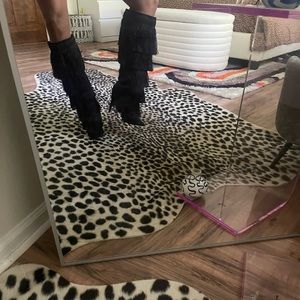 Fringe knee high boots.